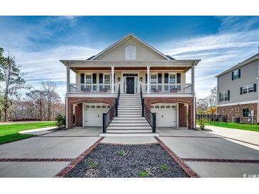 Charming two-story home with a front porch, two car garage and beautifully landscaped yard at 232 Wahee Pl., Conway, SC 29527