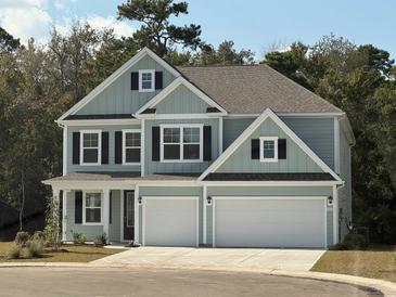 Charming two-story home featuring a two-car garage, beautiful architectural details, and professional landscaping at 515 Haven View Way, Murrells Inlet, SC 29576