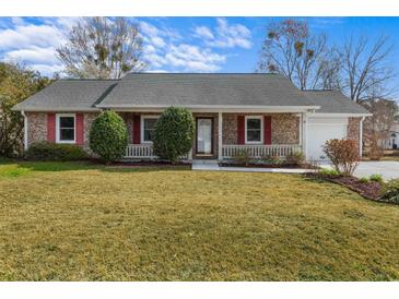 Charming single-story brick home with red shutters and a cozy front porch at 614 Cavandish Dr., Myrtle Beach, SC 29588