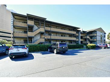 Attractive condo complex with multiple levels, private balconies and parking area for residents and guests at 9501 Shore Dr. # D-337, Myrtle Beach, SC 29572