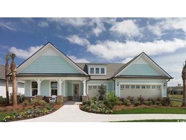 Charming single-story home featuring a landscaped yard, welcoming front porch, and two-car garage at 1436 Crested Iris Way, North Myrtle Beach, SC 29582