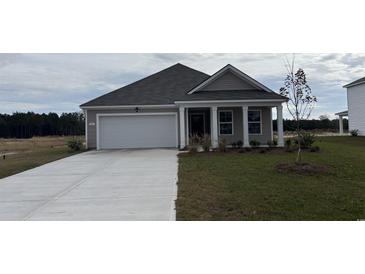Charming single-Gathering home with a well-manicured lawn, a two-car garage, and inviting curb appeal at 433 Acosta Circle, Conway, SC 29527