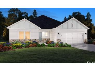 Charming single-story home featuring stone accents, a manicured lawn, and an attached two-car garage at 5040 Riverton Ct, Myrtle Beach, SC 29579