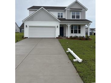 Charming two-story home featuring a two-car garage, and a welcoming front porch at 5430 Shelly Lynn Dr., Myrtle Beach, SC 29579