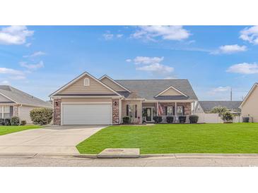 Charming single-story home with well-maintained lawn, attached two-car garage, and inviting front porch at 110 Echaw Dr., Conway, SC 29526