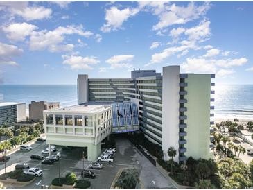 A large condo complex at the ocean with a beach front view and a parking area near the building at 1105 S Ocean Blvd. # 220, Myrtle Beach, SC 29577