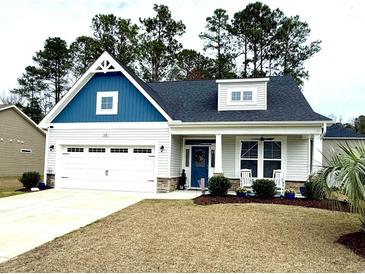 Charming single-Gathering home featuring a well-maintained lawn and attached two-car garage at 378 Dunbarton Ln., Conway, SC 29526