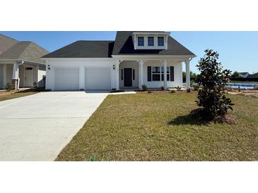 Charming one-story home with attached two car garage and well manicured lawn at 1071 Laconic Dr., Myrtle Beach, SC 29588
