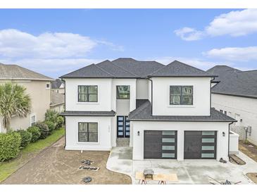 Striking two-story home with a three car garage and modern architectural details at 1217 Bentcreek Ln., Myrtle Beach, SC 29579