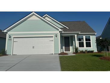 Charming single-Gathering home features a 2 car garage, well-manicured lawn, and a light blue exterior at 1249 Crested Iris Way, North Myrtle Beach, SC 29582