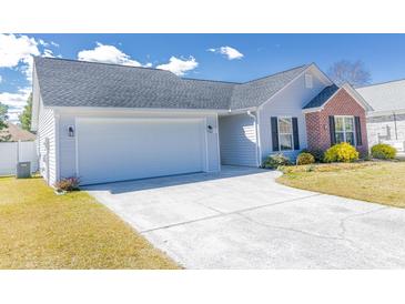 Charming single-story home featuring an attached two-car garage and well-maintained landscaping at 217 Sienna Dr., Little River, SC 29566