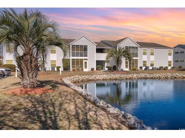Waterfront condos with scenic pond views and lush tropical landscaping enhance this attractive complex at 2258 Huntingdon Dr. # B, Myrtle Beach, SC 29575