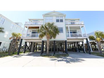 Beautiful stilted beach house with covered parking and multiple decks for enjoying coastal breezes and ocean views at 225-B Dogwood Dr. N, Murrells Inlet, SC 29576