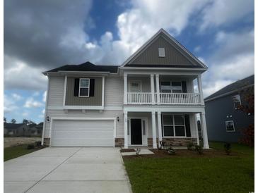 Charming two-story home with a covered porch, attached garage, and neutral color palette at 4035 Bucolic Loop, Myrtle Beach, SC 29588