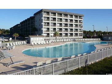 Large outdoor pool with lots of seating at a condo complex near the beach at 5905 S Kings Highway # 416-A, Myrtle Beach, SC 29575