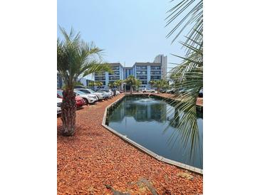 Beautiful condos overlooking a scenic pond with lush landscaping and ample parking at 5905 S Kings Hwy. # 216B, Myrtle Beach, SC 29577