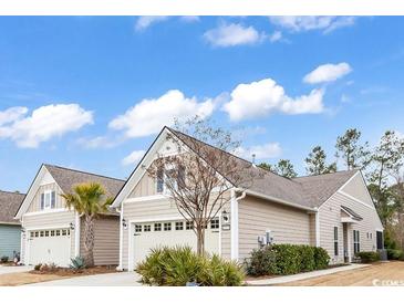 Charming home with a manicured front yard, attached garage and neutral color palette at 6013 Tramonto St., Myrtle Beach, SC 29577