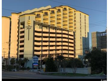 Exterior daytime view of the Monterey Bay Beach House Resort featuring multiple floors of condos and integrated parking garage at 6804 N Ocean Blvd. # 1237, Myrtle Beach, SC 29572