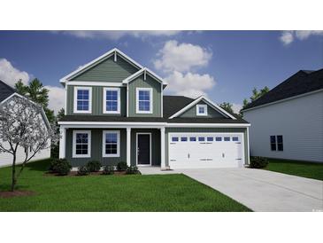 Charming two-story home with green siding, white trim, an attached two-car garage, and a well-manicured lawn at 900 Agostino Dr., Myrtle Beach, SC 29579