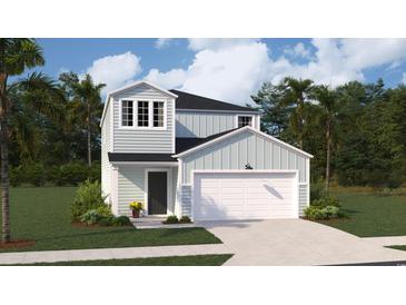 Charming two-story home with light blue siding, a two-car garage, and a well-manicured lawn at 1369 Palm Springs Paloma Dr, Longs, SC 29568