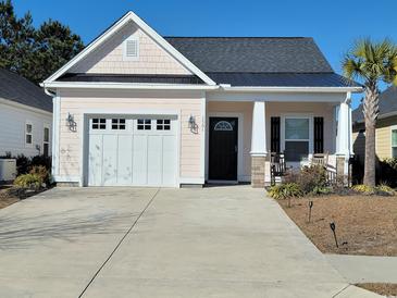 Charming single-story home with a well-manicured lawn and a two-car garage at 1501 Ferney Dr., Conway, SC 29526