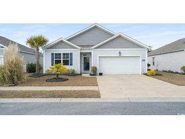 Charming single-story home with a well-manicured lawn and attached garage, perfect for a small Gathering or retirees at 2882 Ophelia Way, Myrtle Beach, SC 29577