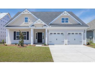 Charming two-story home with a two car garage, landscaped yard, and welcoming front porch at 4028 Bucolic Loop, Myrtle Beach, SC 29588