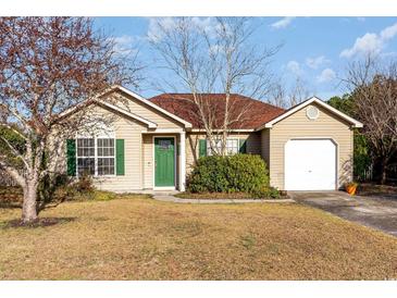 Charming single-story home with green shutters and a well-maintained front lawn at 6006 Quinn Rd., Myrtle Beach, SC 29579
