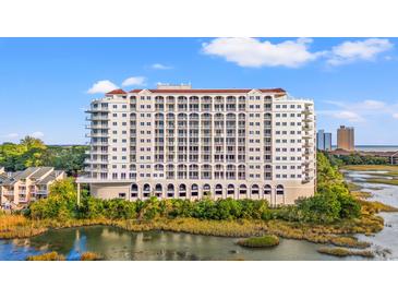 Stunning condominium building boasting multiple floors and a scenic waterfront view at 9547 Edgerton Dr. # 301, Myrtle Beach, SC 29572