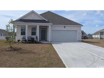 Charming single-story home with well-maintained lawn and attached two-car garage at 1460 Porchfield Dr., Conway, SC 29526