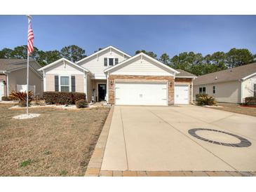 Charming single-story home featuring a spacious driveway and attached two-car garage at 161 Copper Leaf Dr., Myrtle Beach, SC 29588