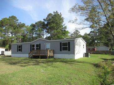 Charming single-story home features a well-maintained yard and a cozy front porch at 2016 Misty Morning Dr., Conway, SC 29527