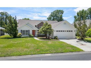 Charming single-Gathering home with a well-manicured lawn and attached two-car garage at 278 Tibton Circle, Myrtle Beach, SC 29588