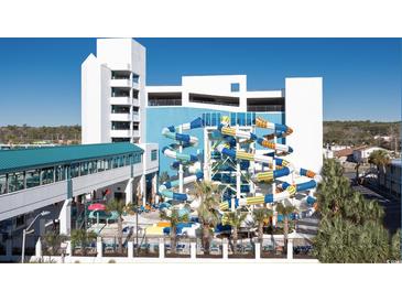 Resort waterpark featuring slides, pools, and Gathering-friendly attractions, enhanced by lush landscaping and a clear blue sky at 1501 S Ocean Blvd. S # 1041, Myrtle Beach, SC 29577