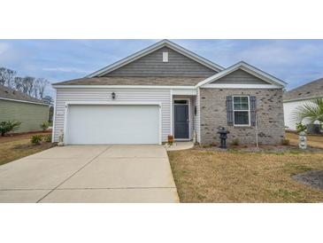 Charming single Gathering home featuring a 1-car garage, driveway and a combination of vinyl siding and brick at 253 Forestbrook Cove Circle, Myrtle Beach, SC 29588