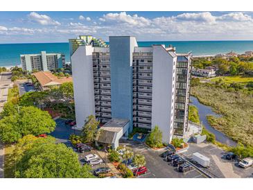 Stunning aerial view of the high-rise condo building overlooking the beach, ocean, and waterway at 311 69Th Ave. N # 505, Myrtle Beach, SC 29572