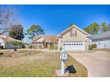 Charming single-Gathering home with a well-manicured lawn and a traditional mailbox at 3964 Lochview Dr., Myrtle Beach, SC 29588