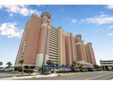 Large condo building with multiple floors, balconies, and parking available at 2710 S Ocean Blvd. # 1010, North Myrtle Beach, SC 29582