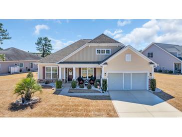 Charming single-story home with a manicured lawn, featuring a two-car garage and covered front porch at 514 Hillsborough Dr., Conway, SC 29526