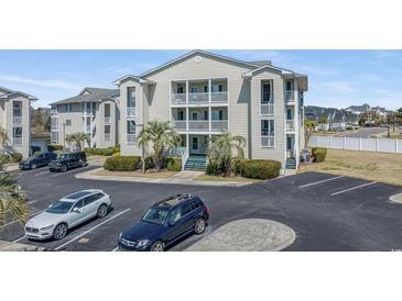 Inviting condo with palm trees and ample parking, perfect for coastal living at 212 Landing Rd. # G, North Myrtle Beach, SC 29582