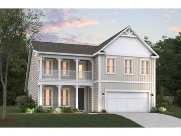 Charming two-story home featuring double balconies, a two-car garage, and craftsman-style details at 115 Northbrook Dr, Murrells Inlet, SC 29576