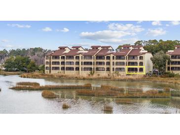Multi-story waterfront condo building with views of the marsh and natural surroundings at 501 Maison Dr. # F-1, Myrtle Beach, SC 29572