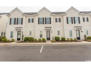 Charming townhome exterior with black shutters, tidy landscaping, and convenient parking in front at 845 Hall Lane # B, Myrtle Beach, SC 29577
