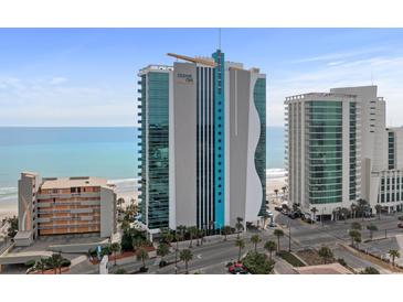Oceans One resort view showcasing the building's architectural design against the backdrop of a sunny beach at 107 S Ocean Blvd. # 2106, Myrtle Beach, SC 29577