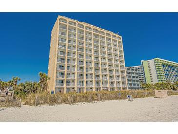 Oceanfront condo building with private balconies and beach access on a bright sunny day at 1207 S Ocean Blvd. # 20206, Myrtle Beach, SC 29577