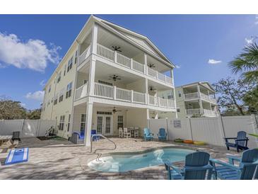Beautiful multi-story beach house featuring a private pool and multiple balconies for enjoying outdoor living at 703 37Th Ave. S, North Myrtle Beach, SC 29582