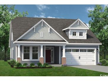 Charming one-story home with beautiful landscaping, a two-car garage, and a welcoming front porch at 1522 Breakwater Dr., Little River, SC 29566