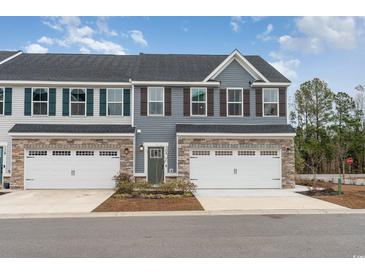 Beautiful two-story townhome with a one car garage and charming curb appeal at 300 Golan Circle # A, Myrtle Beach, SC 29579