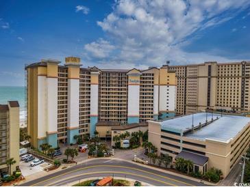 Expansive exterior view of Beach Cove Resort, showcasing its multi-story design and proximity to the ocean at 4800 S Ocean Blvd. # 1418, North Myrtle Beach, SC 29582