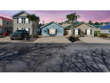 Charming coastal homes with palm trees, showcasing a relaxed neighborhood vibe at 514 Vallecrosia Ct., Little River, SC 29566